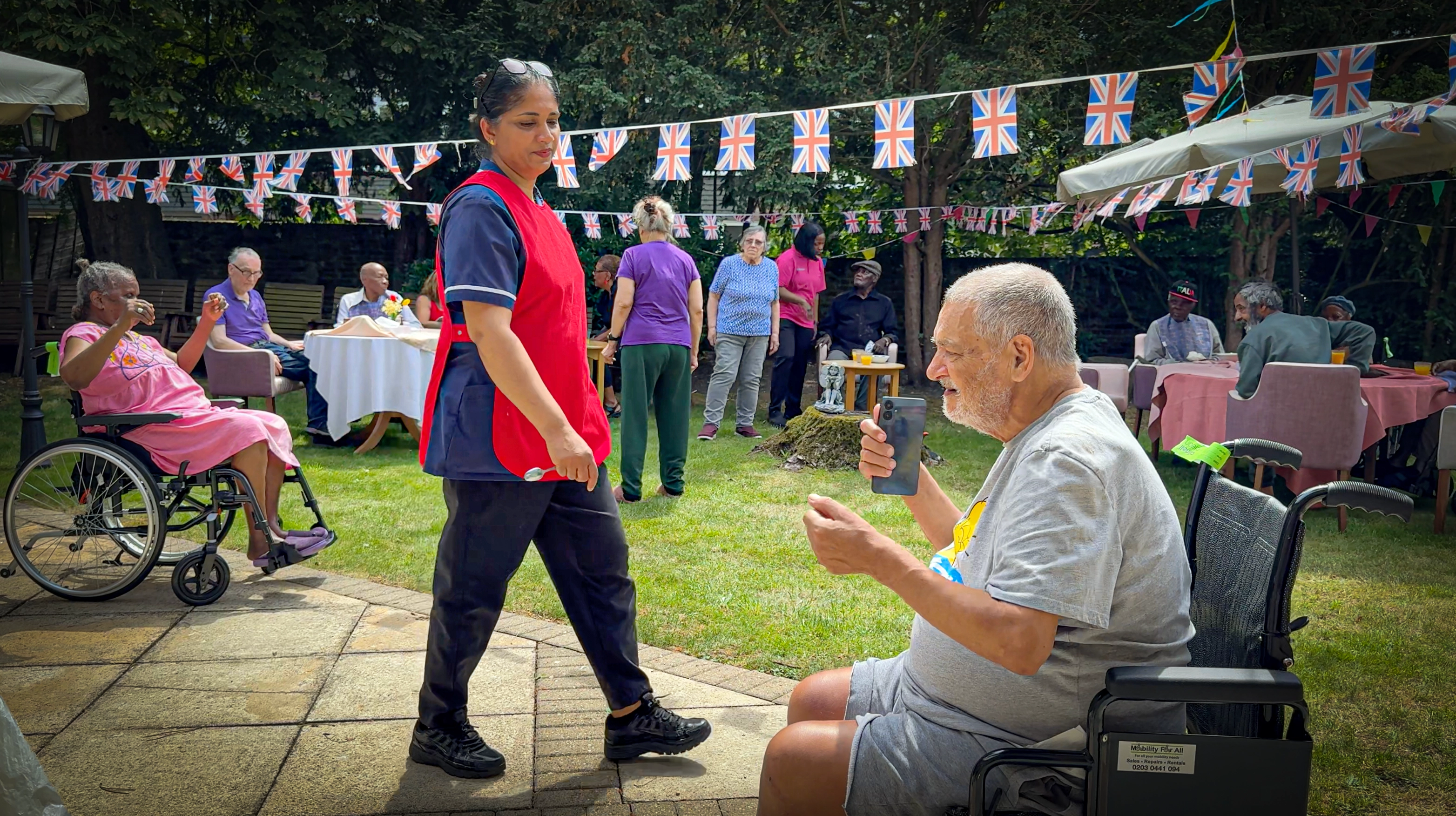Nurse walking with a resident in the peaceful sensory garden